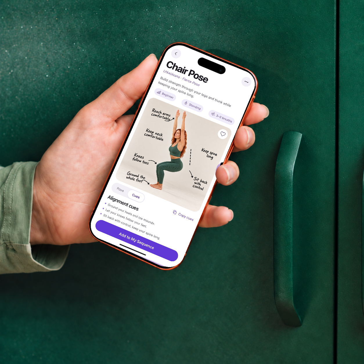 Yoga Space Chair Pose mobile screen with alignment cues shown on a phone held in one hand